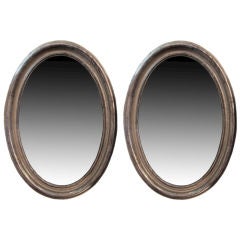 Pair of Oval Louis XVI Style Silver Leafed Mirrors