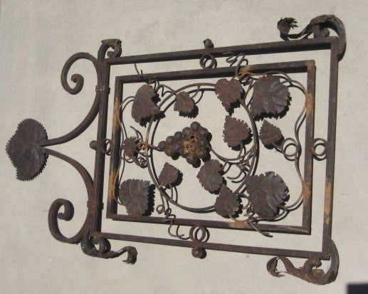 Iron side panel from a lantern with beautiful grapevine and leaf details.