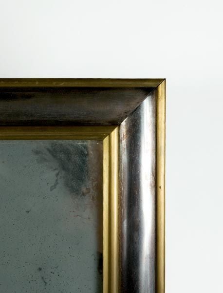 Brass and blued steel antique mirror. Wonderful patination to the steel as well as the mirror.