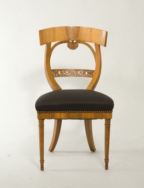 Sculptural suite of Biedermeier sidechairs with intricate carved detailing. Upholstered in black fabric.<br />
Seat Depth - 15