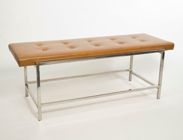 A sleek Mid-Century Dunbar chrome and caramel leather bench.