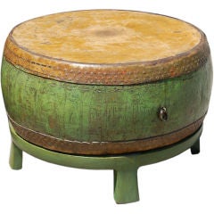 Antique drum on wood stand.