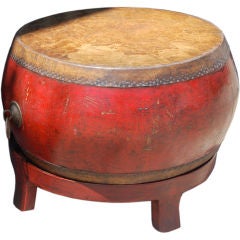 Antique drum on wood stand.