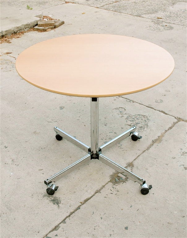 Hi-tech cafe-size table for work or espresso with locking castors