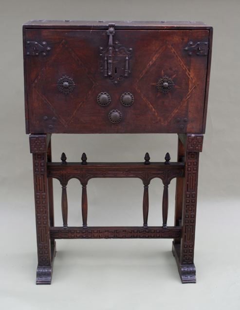 Beautiful vargueno with drop front closure a top columnar stand.  It features an array of drawers and doors with Moorish patterned bone inlay.  It dates to the late 1700 to early 1800s.  It has its original iron hardware and surface patina.
