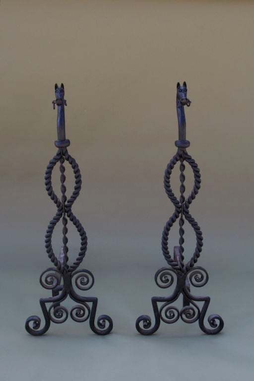 Finely crafted andirons with exceptional twisted ironwork.