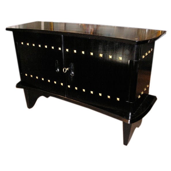 A  bronze studded ebonised wood sideboard For Sale