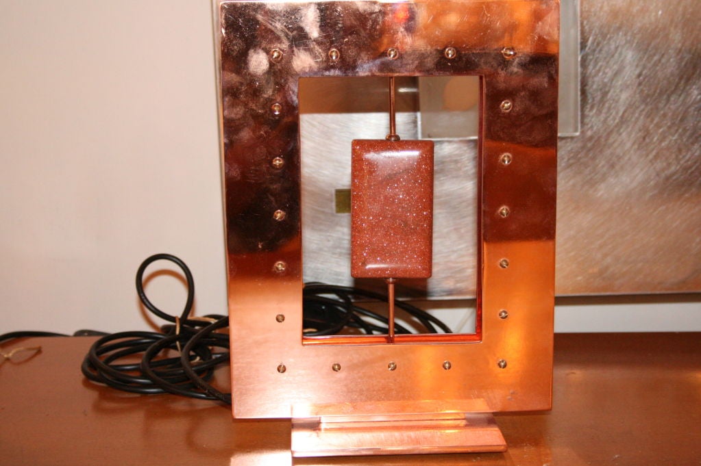 A beautiful pair of table lights, handcrafted copper structure holding a large aventurina stone with silk shades. BY Roberto Rida