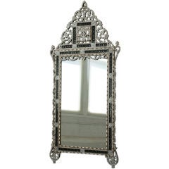 An Ottoman style mirror with  mother of pearl inlay