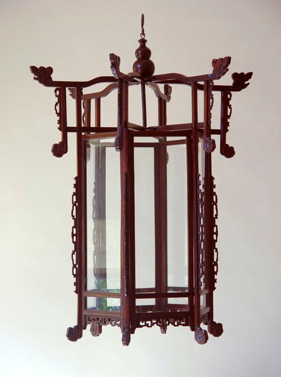 A carved  rosewood Chinoiserie lantern- hexagonal shaped, as is,glass panels are modern, not wired<br />
Height-42