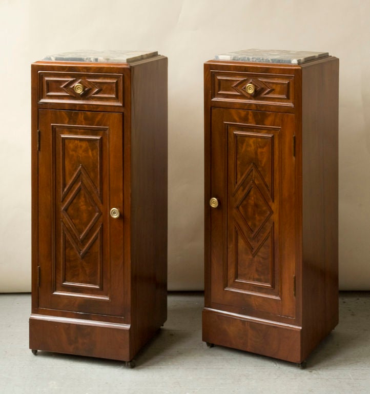 A pair of Charles X style mahogany nightstands, single drawer with lower door compartment, bronze pulls, inset breche orientale de Baixas marble tops, Continental possibly Spanish, late 19th century

Measures: Width 12½