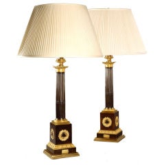 A PAIR OF EMPIRE BRONZE AND GILT LAMPS