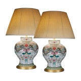A PAIR OF FAMILLE ROSE JARS MOUNTED AS LAMPS