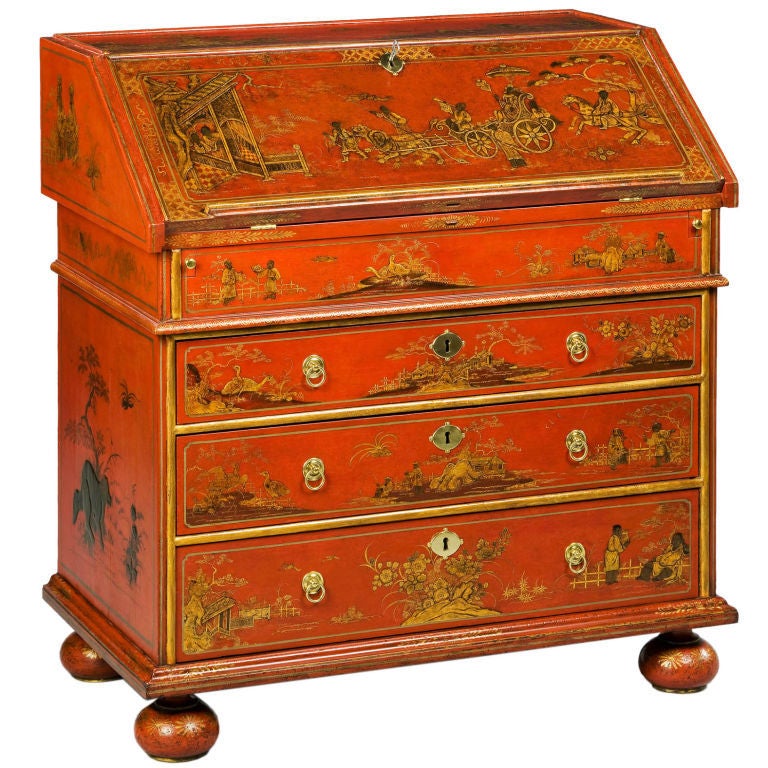 A very fine William and Mary red japanned slope bureau, the fall front is finely decorated with a ceremonial chariot pulled by lions, the lion motif is repeated on the top, the fall opens to reveal a well which slides to reveal a secret compartment;
