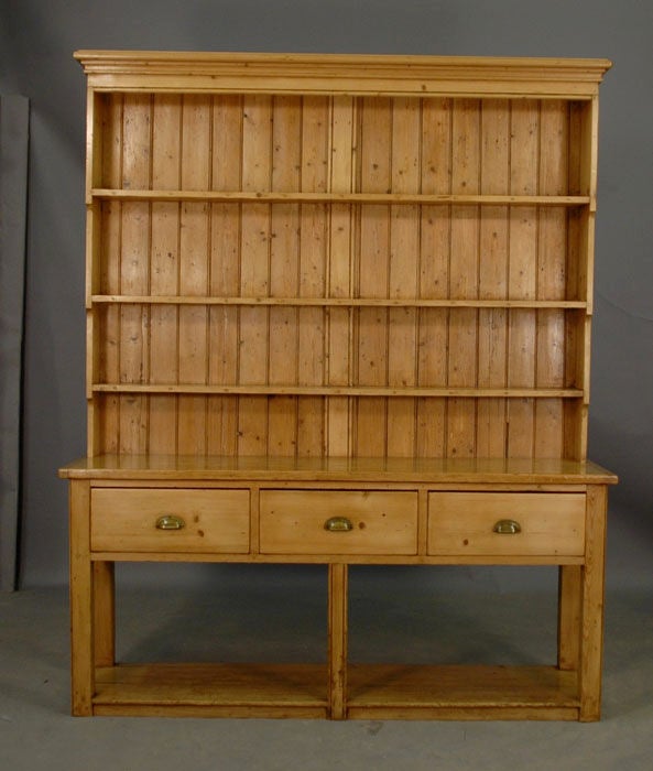 English Pine Pot Board Dressers were used in kitchens as they held the dishes, cutlery and cooking pots. Pine dressers were considered to be poor mans furniture so they were always painted.
Twenty layers of various colors of paint  were stripped