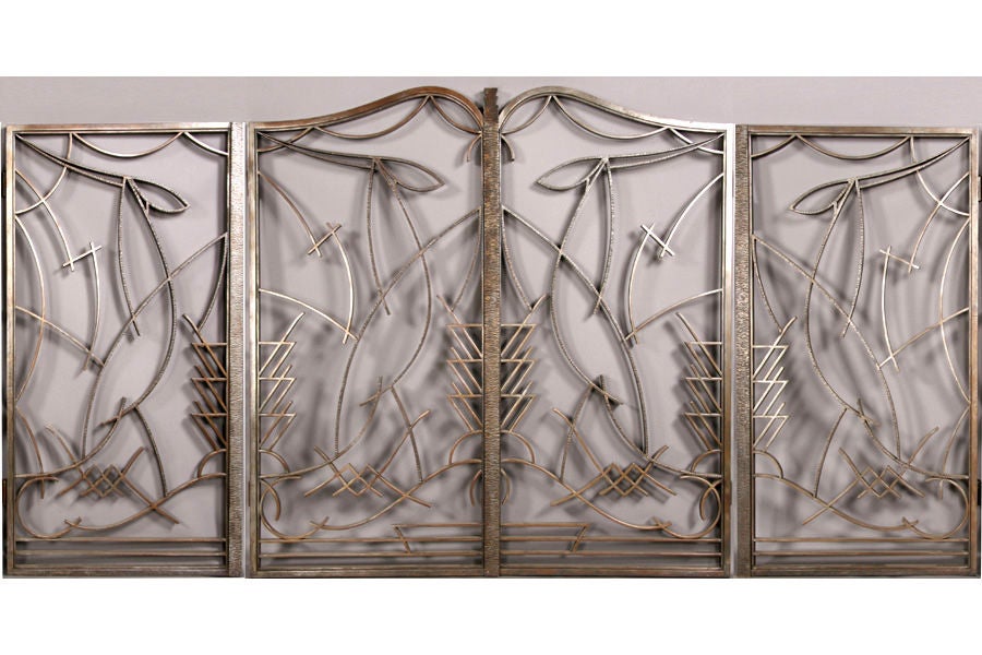 This large, rare set of early 1930s, French wrought iron gates are brilliantly designed and expertly crafted, exhibiting the abstracted gazelle forms and calligraphic iron bars that characterized the work of Raymond Subes and other masters in the