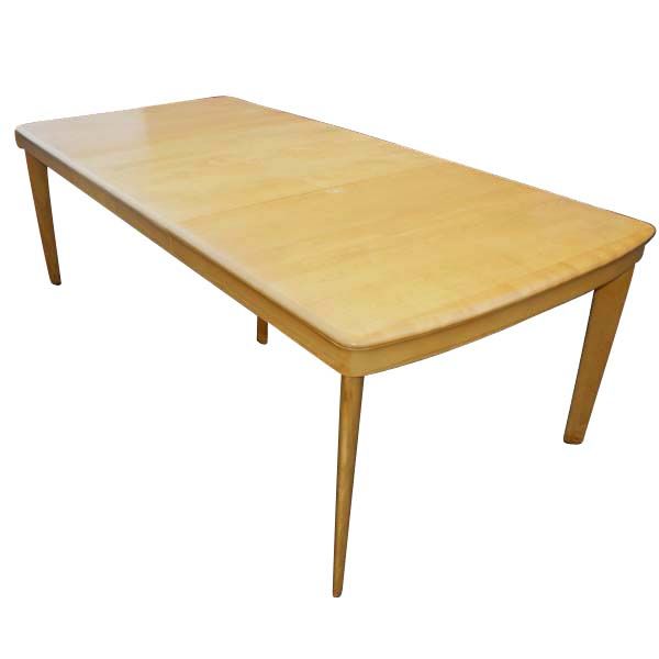 A mid century modern Heywood Wakefield dining table with two leaves and six chairs.  The table is model M165G which was produced from 1947-1952.  With two 15