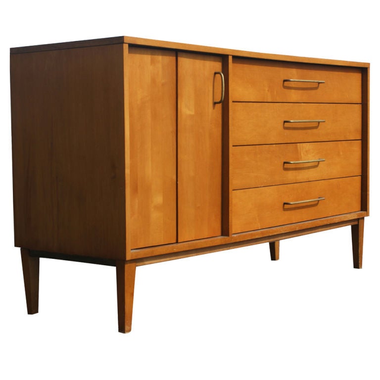 A mid century modern buffet designed by Milo Baughman for Winchendon in the 1950's.  Four drawers and one compartment with bifold doors for storage.