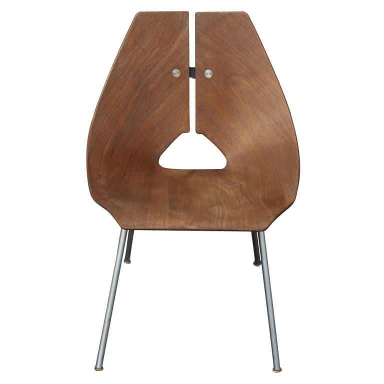 A mid century modern side chair designed by Ray Komai for J.G. Furniture in 1949, model #939.  Molded walnut plywood shell with a chromed steel base and back insert.  Examples of this chair are in the permanent design collections of several major