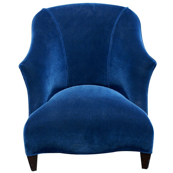 A Donghia Shell Chair part of the Bellagio Collection.  This chair displays the quality of design and materials associated with Donghia.  It has a hardwood frame, double coiled hand tied springs, and is upholstered in Royal Blue Mohair.  The legs