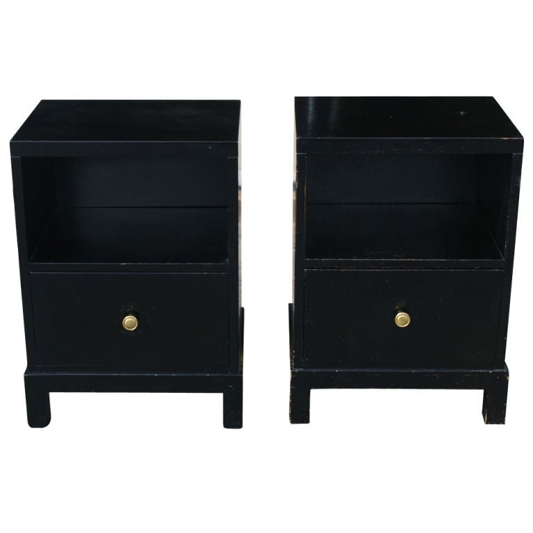 A pair of nightstands designed by T.H. Robbsjohn-Gibbings for Widdicomb in 1946.  Black lacquer finish with a silver finished knob.  One drawer and one open shelf.  Newly refinished.