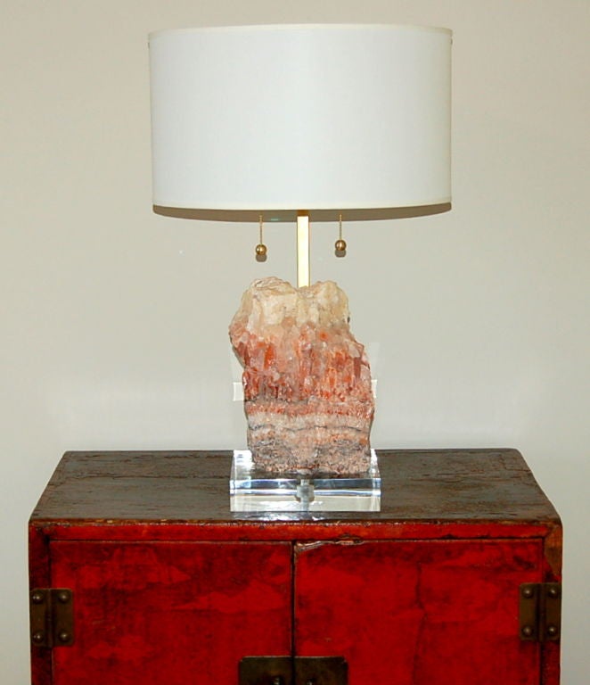 Beautiful boulder of salmon colored calcite mounted on a Lucite chunk base with solid brass figurine mount from Swank Lighting.  Masculine accent lamp perfect for a study, den or office.<br />
<br />
26 inches to top of double cluster socket.<br