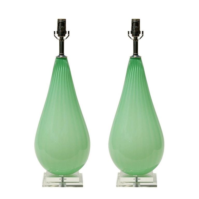 Matched pair of Teardrop glass table lamps in MINT GREEN. The lamps are handblown by Joe Cariati and signed by the artist, exclusively Blown for Swank Lighting.

The lamps are 26 inches from tabletop to socket top. The glass is 18 inches tall. As