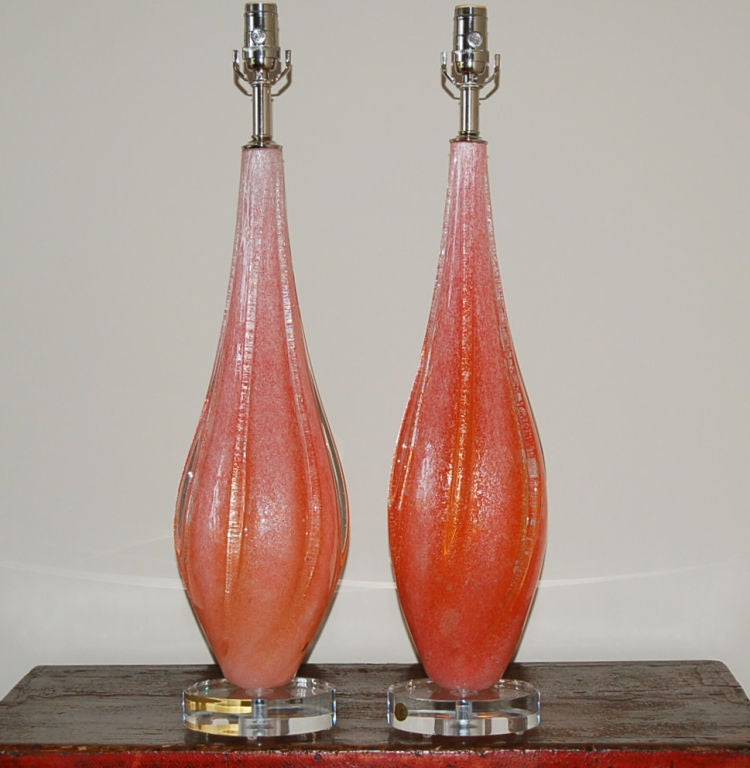 These vintage Pulegoso Murano lamps are the color of RUBY RED GRAPEFRUIT - tiny bubbles in the glass give them a frosted look. These lamps really glow when the sun hits them!

They measure 28 inches to the socket top. As shown, the top of shade is