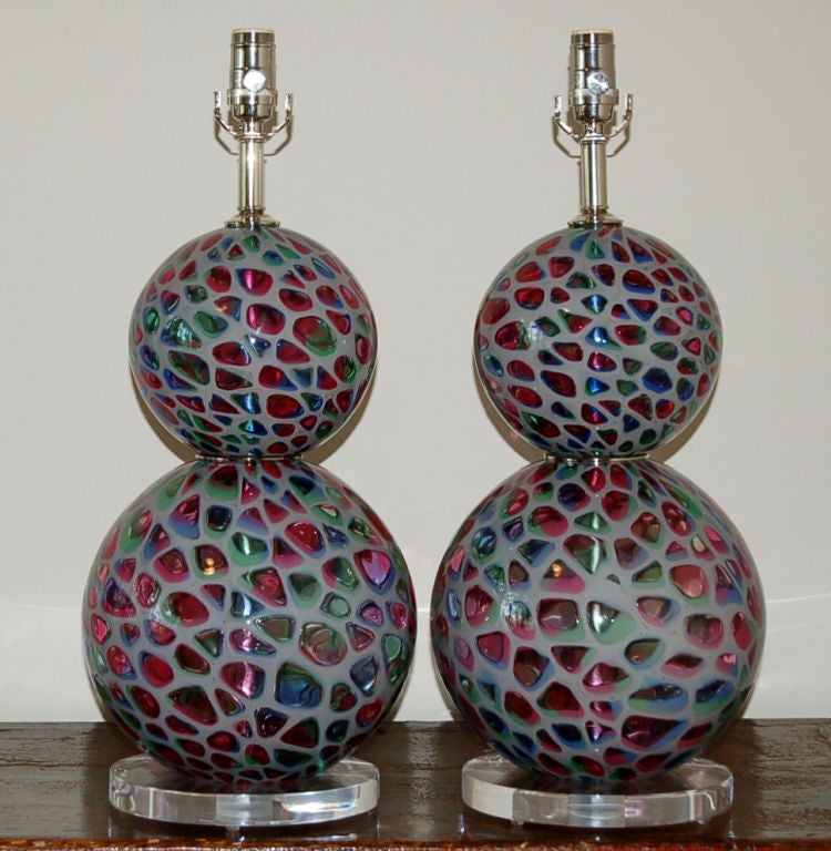 These lamps were blown in 1955, as a take on the Tiffany stained glass lamp design. Very few were made and even fewer are around today. Extremely rare and our very last pair. 

These lamps measure 24 inches to top of socket. As shown, the top of