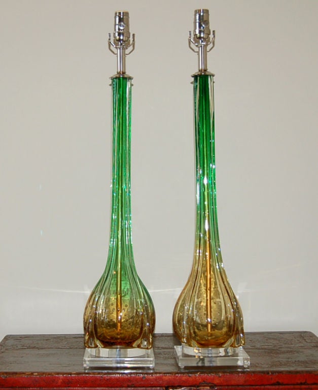 Early Space Age design in apple green and gold with controlled bubbles, long slender neck, and flared fins that ascend the length of the lamp.

The lamps measure 28 inches from tabletop to top of socket. As shown, the top of shade is 34 inches