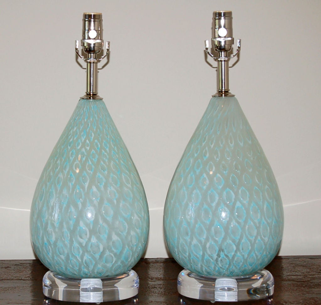 Vintage Murano lamps by Giorgio Ferro in his signature peacock feather design with solid brass hardware which has been nickel plated. <br />
<br />
22