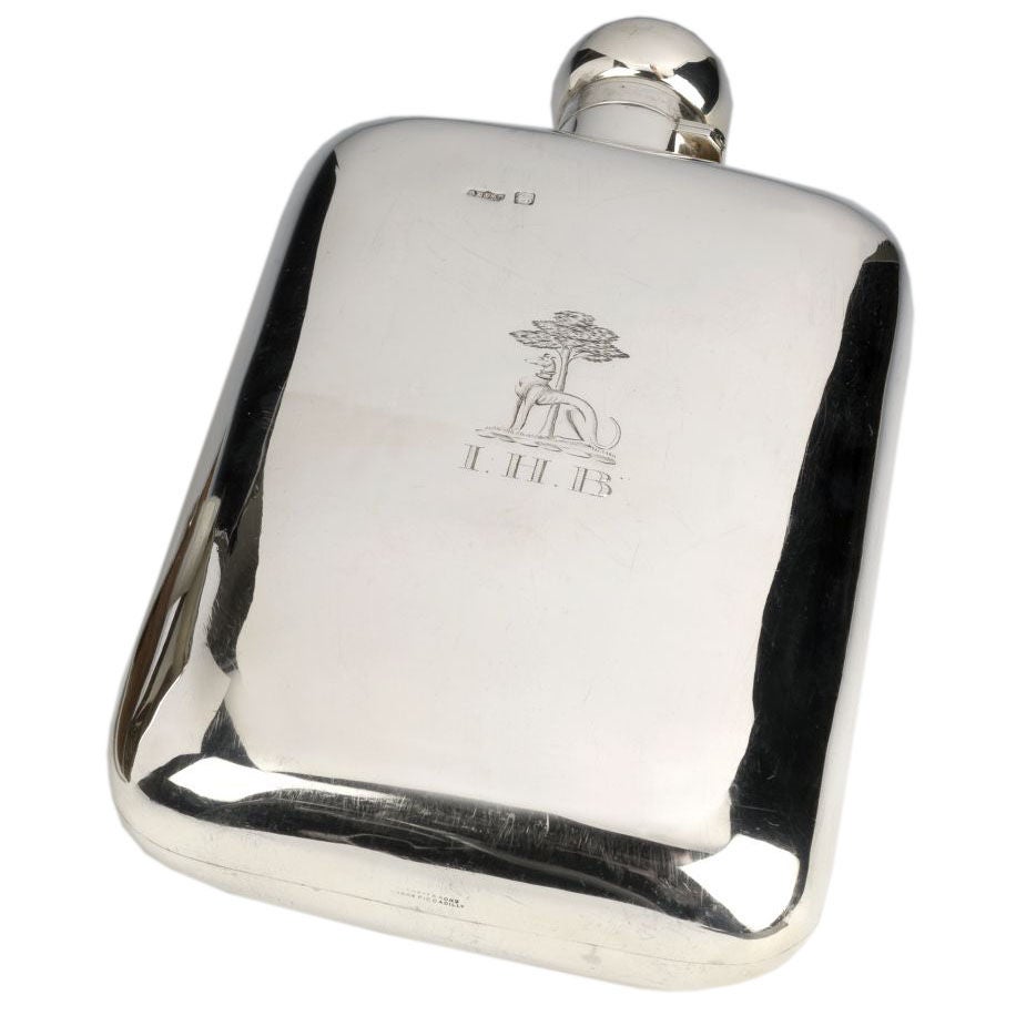Antique Sterling silver hipflask with greyhound crest.