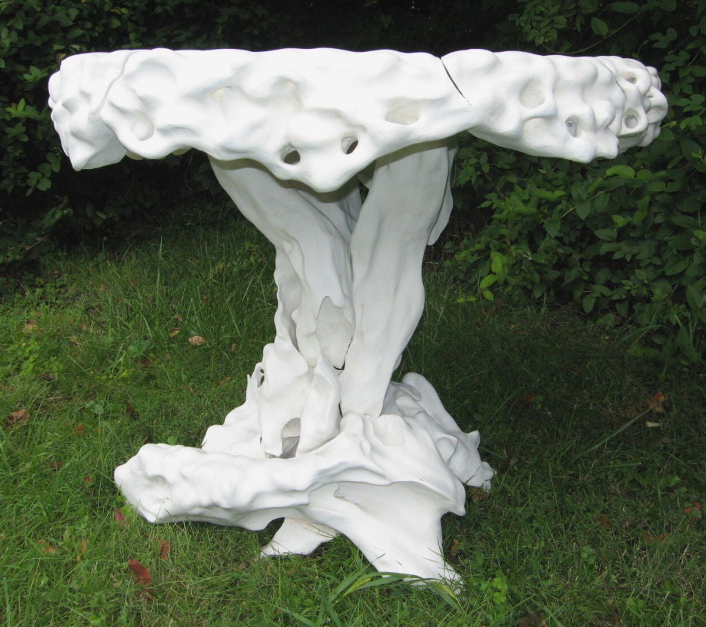 Dramatic carved and white painted rootwood center table