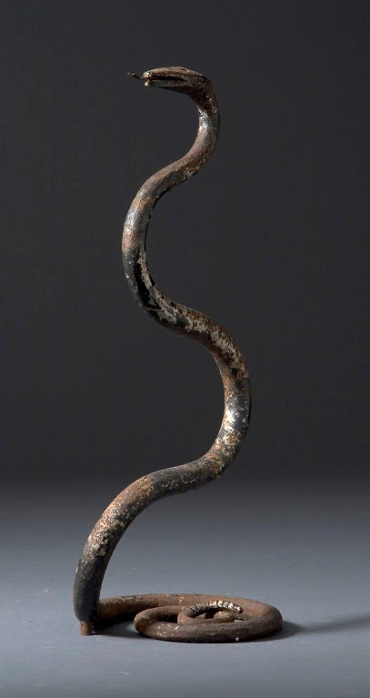 Hand Forged Iron Snake<br />
Texas<br />
Coiled snake with forked tongue and rattler tail.
