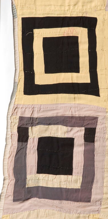 Graphic Concentric Square Quilt<br />
Circa 1940<br />
Hand- stitched black, yellow and gray African American quilt made of rayon.