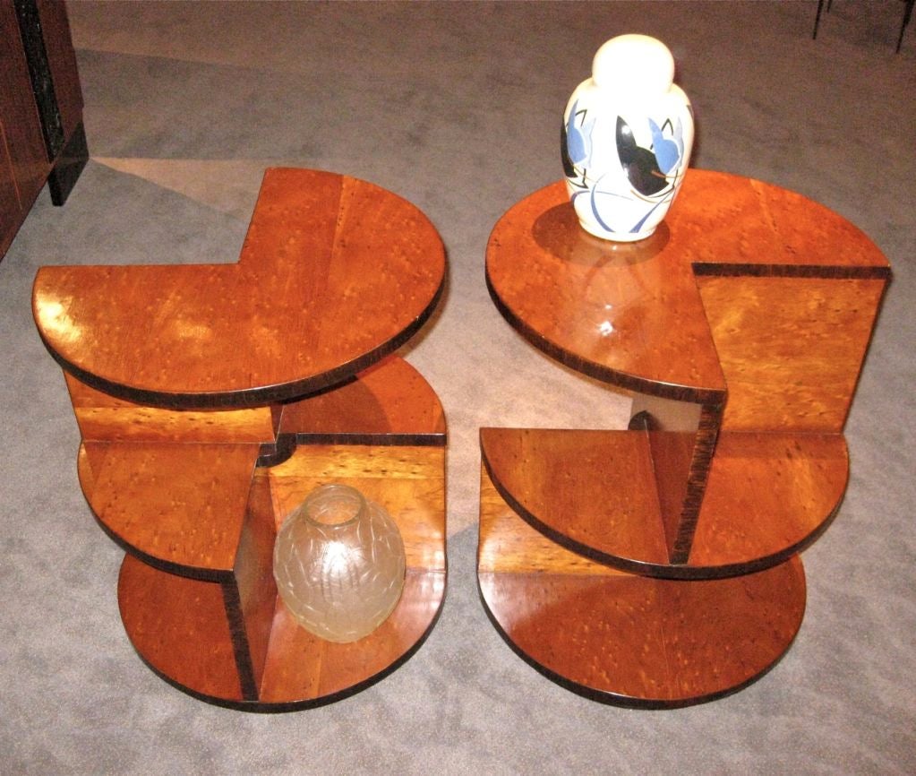 Custom-made for Art Deco collection, these cleverly designed, French-inspired, modernist style, three-tiered side tables are easily as interesting as anything they'd hold. They're made with gorgeous amber stained bird's-eye maple with an outline