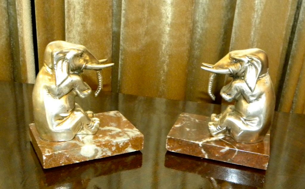 Elephants are good luck, with two you will have all the luck you will ever need. This pair of sitting French Elephants made of white metal with a nickel finish seem to be pleased with their life. Maybe they are a cousin of Babar or maybe they just