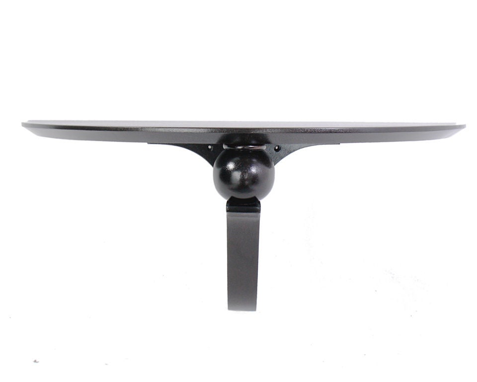 Demilune Console Table or Wall Shelf, designed by Edward Wormley for Dunbar, circa 1940's. This piece is a versatile size and can be used as a console table in a foyer or other area with limited space, or as a shelf space for display.