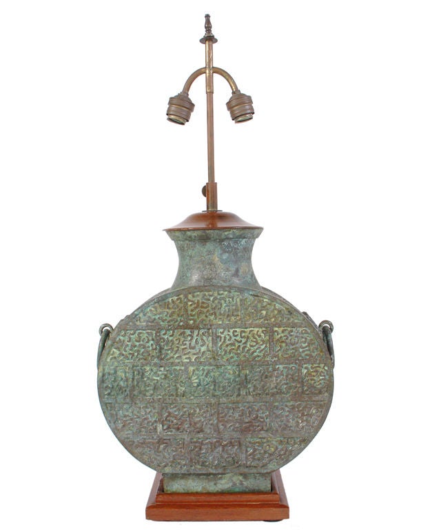 Large Scale Asian Bronze Lamp with Outstanding Decoration and Verdigris Patina. We are unsure of the age of this lamp. It appears to be at least 1930's, due to the lamp fittings and hardware, which are French in origin. The bronze vessel itself is