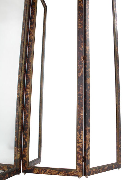 Glamorous Faux Tortoise Shell Mirrored Screen, circa 1960's. Heavyweight construction with nice attention to detail. Three hinged panels open to various angles to suit your needs. This piece is a versatile size and would be a great screen, room