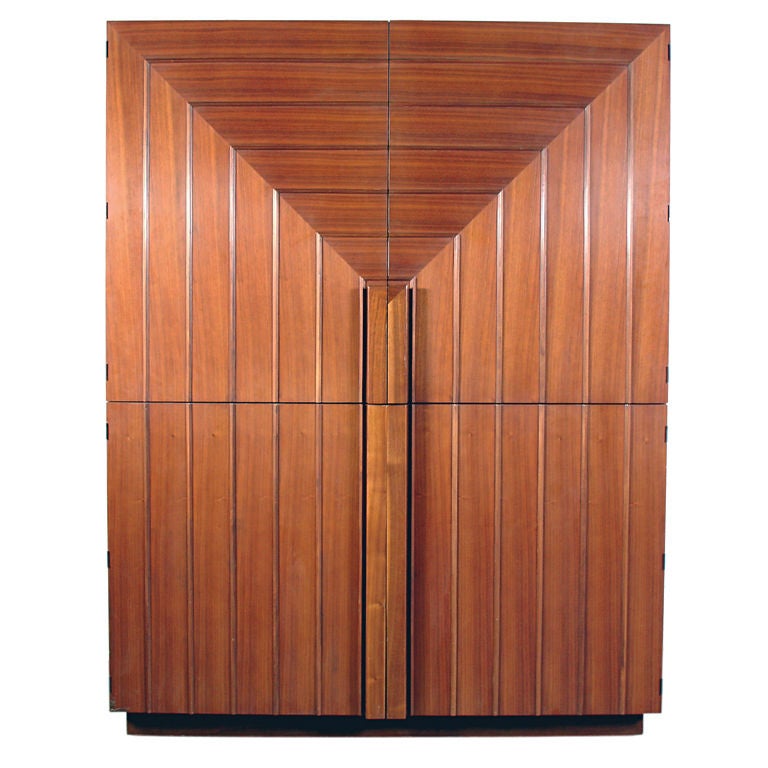 Sculptural Armoire or Media Cabinet, designed by T.H. Robsjohn Gibbings. This is a re-edition of a 1950's Gibbings design produced by Baker in the 1990's. It offers a voluminous amount of storage, with the top two doors opening to reveal a large