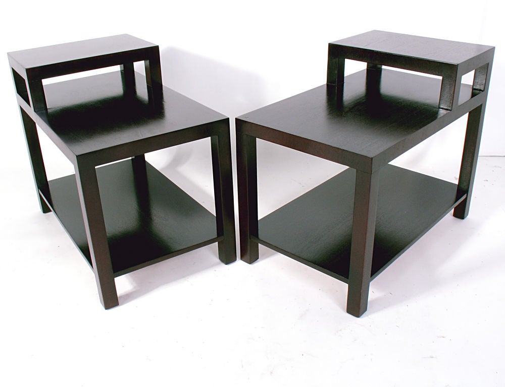 Pair of Stepped Lamp Tables, designed by T.H Robsjohn Gibbings for Widdicomb, circa 1950s. These tables are a versatile size and can be used as end or side tables, or as nightstands. Functional stepped design allows a lamp to sit above the lower