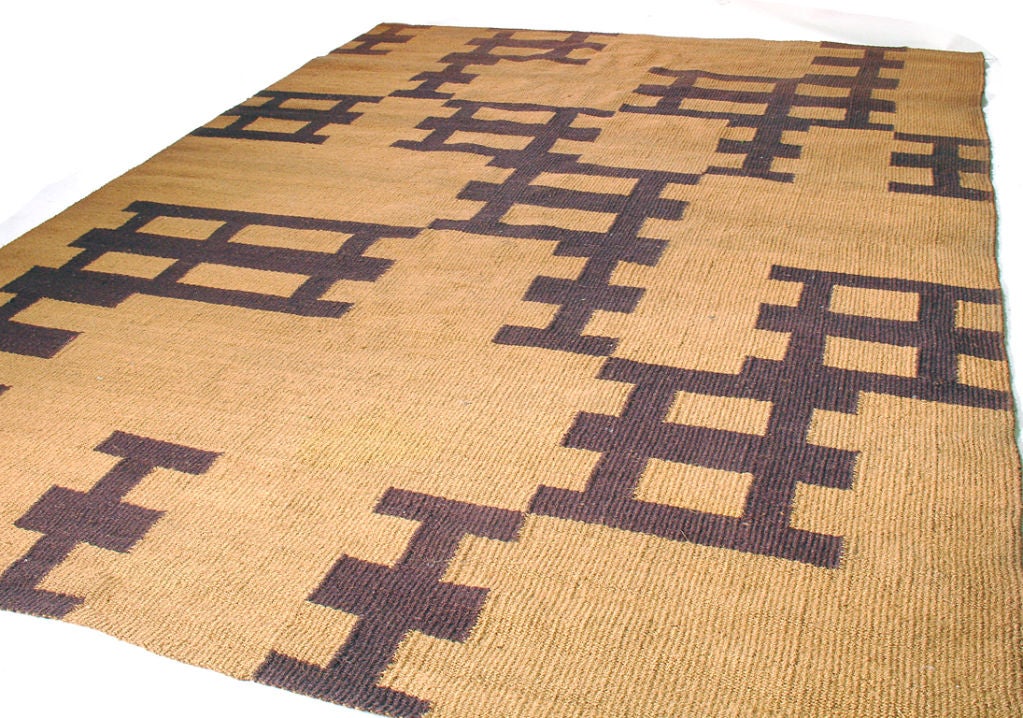 Large Jute Rug with an interesting geometric design, believed to be circa 1980's. It is a large size at nearly 12' x 9'. It is hand woven with a wonderful texture.