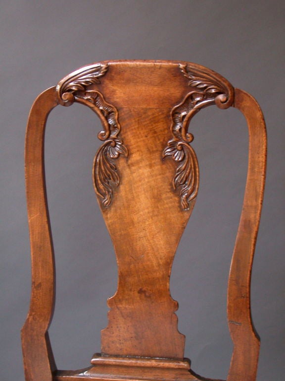 Remarkable  Pair of 18th Century French Canadian Side Chairs.   The waisted shaping of the backs, echoed in the vase-shaped splats, is a very English form of chair,  An early 18th century Queen Anne design, executed in the French Régence style. 