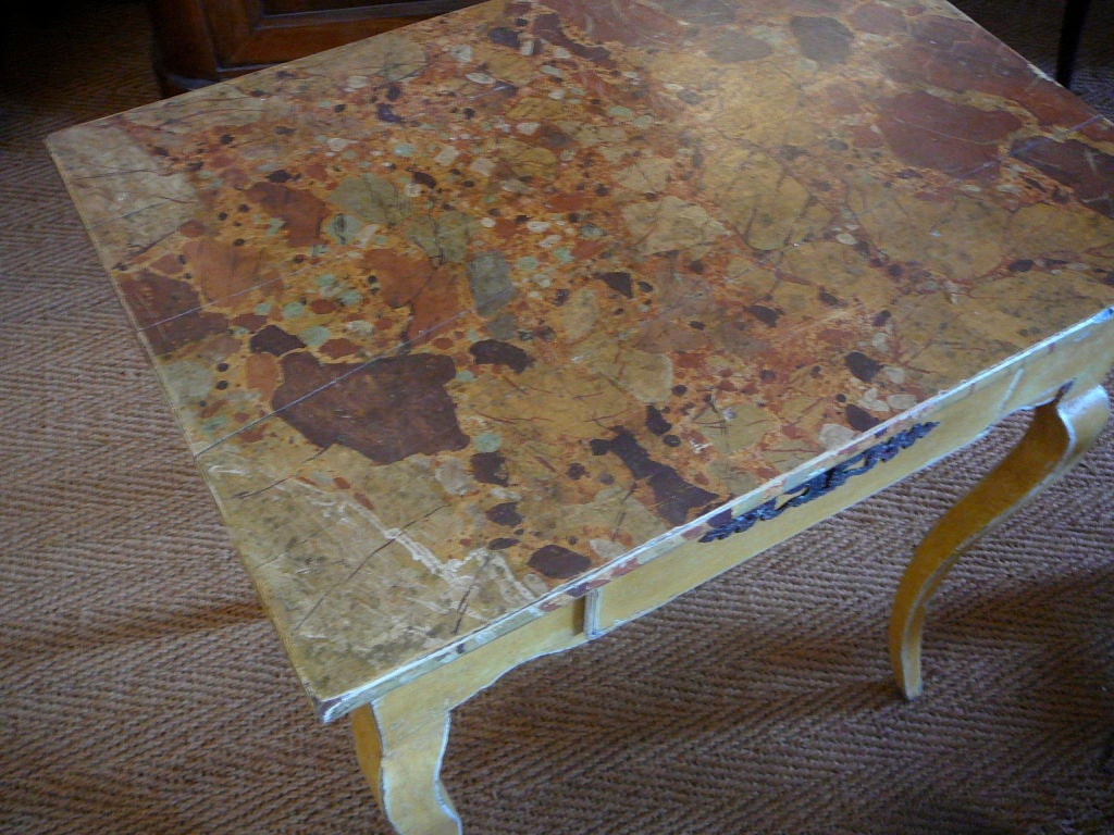 Small 19th Century French Provincial Louis XV Side Table.  Old yellow painted finish to delicate cabriole legs, scalloped apron and single drawers with marbleized top.  Provence circa 1820.