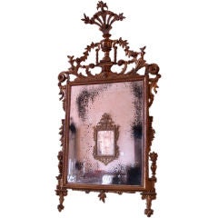 A Fine and Rare Italian Neoclassical Giltwood Mirror.