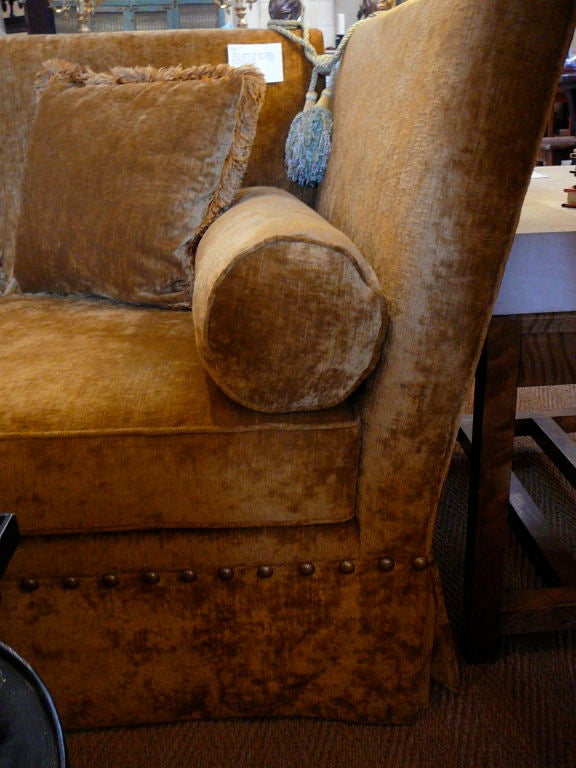 Pair of Georgian Style Knole Settees. Canted sides in the form originally associated with ”Knole” House in Kent. Upholstered in gold antique velvet.
