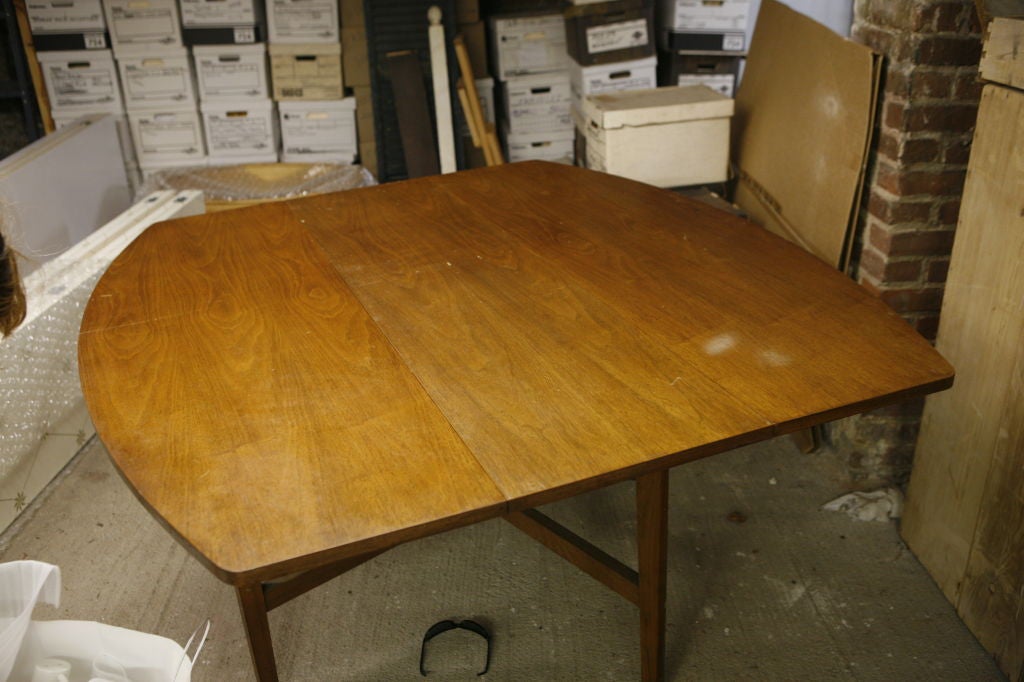 Mahogany drop leaf table <br />
Rectangular with rounded ends<br />
Contains original markings for authenticity