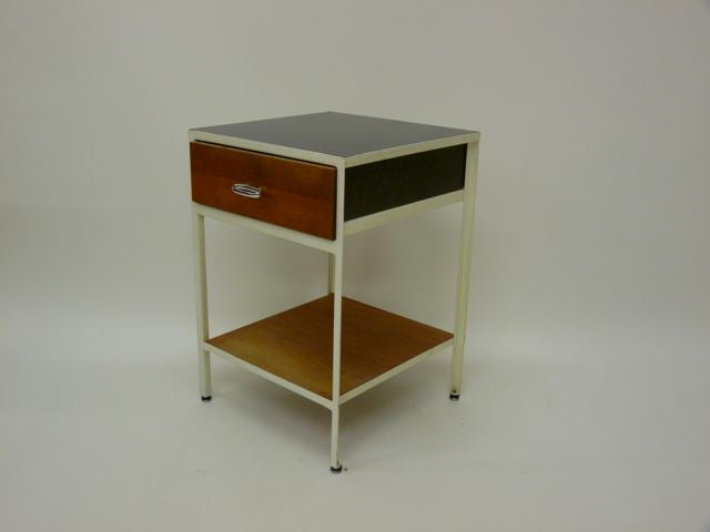 George Nelson steel frame nightstand for Herman Miller.  Black laminate top. White metal frame with walnut drawer.