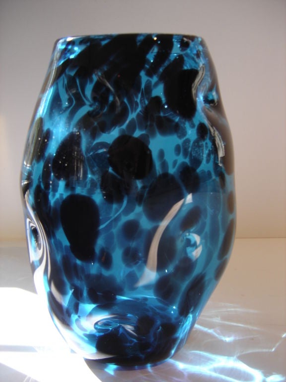 Murano vase in an undulating irregular shape of dark blue and black colored glass unsigned.